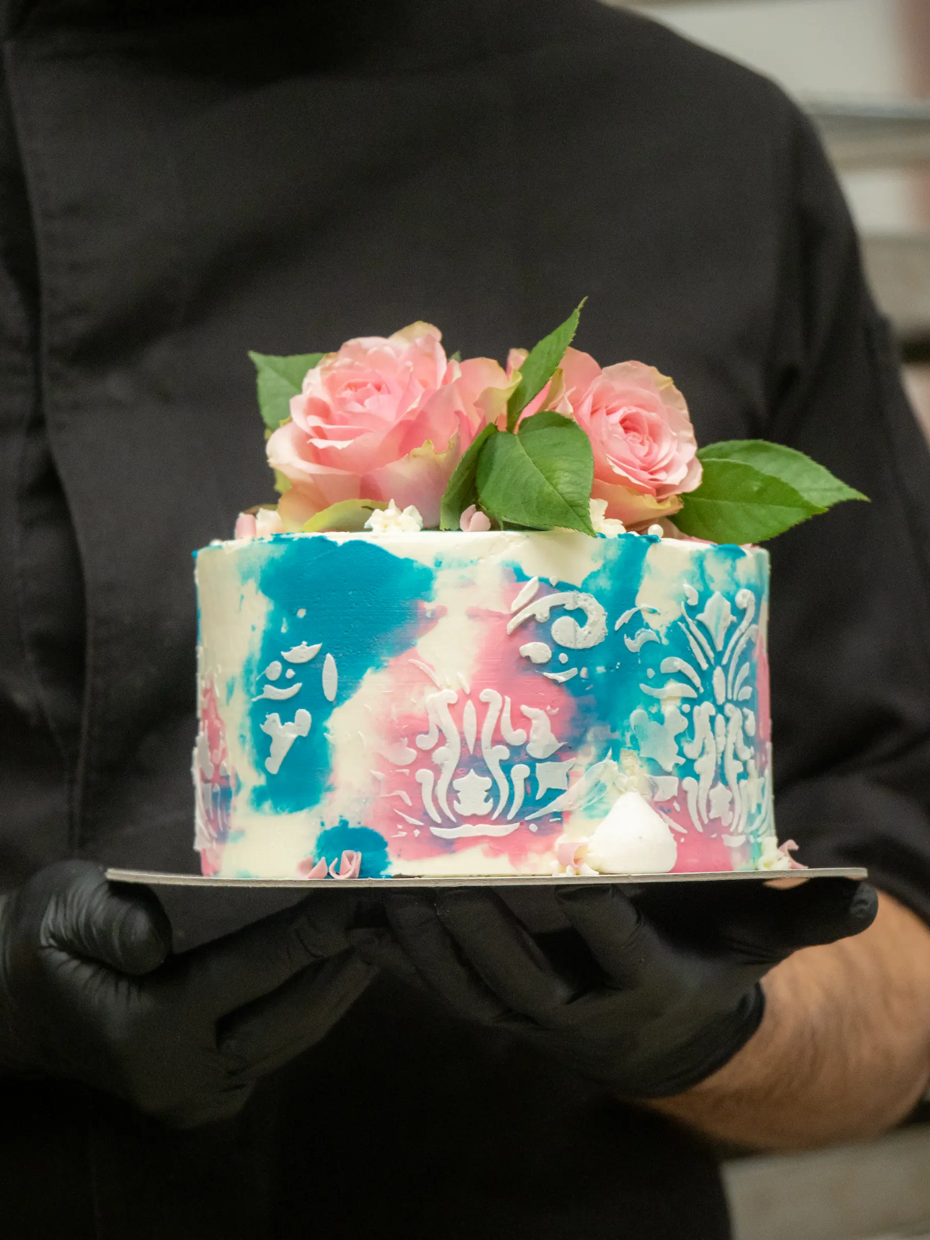 Blue and pink toned designer cake with pink roses poster from BakeOra perfect for elegant celebrations